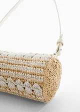 Bolso pequeño de fibra natural redondo con tejido de celulosa y algodón, cierre de cremallera y forro interior.