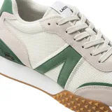 Championes Lacoste L-Spin Deluxe color beige con detalles en verde y suela marrón con textura.