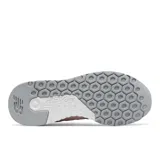 Championes New Balance modelo WRL247SCB para mujer, color rosado pálido, con capellada de malla y gamuza, logo "N" lateral en blanco y entresuela REVlite blanca.