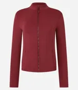 Campera deportiva negra confeccionada en poliamida y elastano, con cuello alto, cierre delantero por cremallera y bolsillos laterales.
