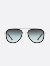 Lentes de sol estilo aviador con marco dorado y lentes degradadas de negro a celeste.