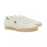 Championes urbanos Lacoste Aura 225 3 SMA, color blanco hueso con logo del cocodrilo en dorado y suela color caramelo.