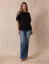 Blusa negra de algodón texturado, marca Ruby Rd, con manga corta amplia y cuello redondo.