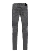 Jean gris de corte slim fit, tiro bajo, rodilla ajustada y pierna ceñida.