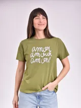 Remera celeste de algodón con estampado de flor y texto "Real View".
