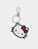Llavero metálico esmaltado con la forma de la cabeza de Hello Kitty, con moño rojo y detalles en negro.