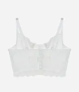 Corset blanco de encaje floral sin copa, con tirantes ajustables y cierre trasero.