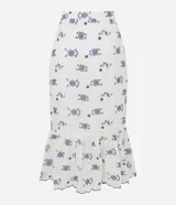 Pollera midi de laise color blanco con bordado de flores y diseño boho.