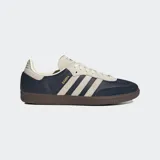 Championes Adidas Samba OG, color azul marino con detalles en beige y suela marrón. Diseño clásico de cuero y gamuza con las tres tiras laterales características de la marca.