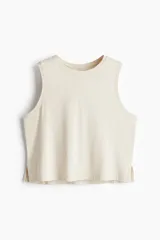 Musculosa deportiva color crema, de corte holgado y tejido DryMove™.