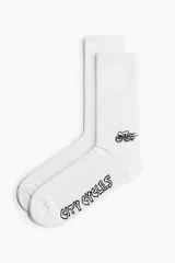 Medias blancas de caña alta acanalada con estampado de bicicleta y texto "City Cycles".