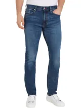 Pantalón de jean azul de corte recto, con efecto desgastado y diseño de cinco bolsillos.