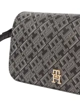 Cartera cruzada de silueta compacta con solapa frontal, confeccionada en poliuretano con forro de poliéster. Presenta un diseño integral con el monograma TH y un monograma TH metálico en la solapa.