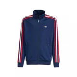 Campera deportiva Adidas Firebird de corte holgado, color azul marino con detalles en rojo y blanco en las mangas.