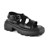 Sandalias negras con plataforma y tiras con textura simil cuero de cocodrilo.