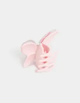Broche para el pelo color rosa pastel con forma de mariposa y detalle de confetti.