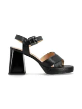 Sandalias negras de cuero con tiras cruzadas, pulsera ajustable en el tobillo, taco de 9,5 cm y plataforma de 2,5 cm.