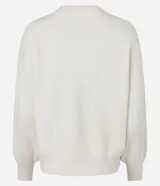 Buzo suéter femenino de tricot color verde esmeralda, con cuello redondo y puños ajustados. Confeccionado con viscosa certificada, poliéster y poliamida.