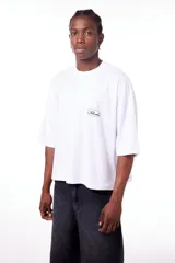 Remerón blanco de algodón con cuello redondo y logo estampado en el pecho. Corte amplio.