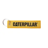Llavero rectangular de tela color amarillo con bordes negros y argolla metálica. Presenta el logo de Caterpillar bordado en negro.
