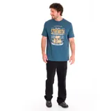 Remera de manga corta color azul petróleo con cuello redondo y estampado gráfico frontal con texto en amarillo y blanco que incluye las palabras "Caterpillar", "Strength & Endurance" y "Bigger Value".