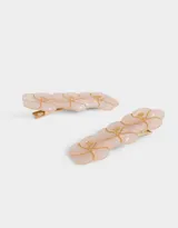 Set de dos hebillas para el pelo con forma rectangular y apliques de flores en resina color rosa y detalles dorados.