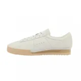 Championes urbanos Lacoste Aura 225 3 SMA, color blanco hueso con logo del cocodrilo en dorado y suela color caramelo.