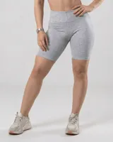 Calza biker deportiva gris melange, tiro alto y largo a la rodilla.