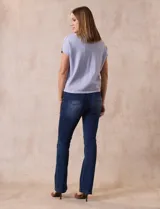 Buzo tejido color lila, marca Ninety. Escote en V. Calado en escote y delantera.