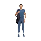 Calza deportiva Puma Essential Tight HW 7/8 color azul con logo negro en la pierna izquierda y bolsillos laterales.