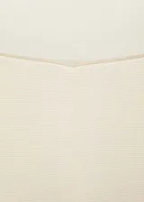 Pantalón palazzo color crema de tejido de punto fino, con cintura elástica y bandas laterales negras en contraste.