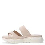 Sandalia de mujer color marrón con tiras cruzadas y hebilla lateral, con plataforma blanca.