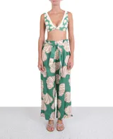 Pantalón de lino verde con estampado de conchas color beige y rosa, corte palazzo y lazo en la cintura.