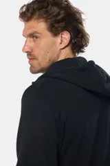 Canguro con cierre y capucha color bordó, confeccionado en felpa de algodón y poliéster.