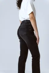 Pantalón de jean negro de corte skinny con tiro alto.