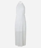 Vestido midi blanco texturizado con lazos en el cuello, espalda descubierta y abertura lateral.
