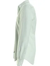 Camisa de hombre Tommy Hilfiger de corte regular, con estampado de cuadros en tonos verde claro, verde oscuro y azul. Tiene cuello abotonado, mangas largas con puños abotonados y logo bordado en el pecho.