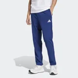 Pantalón deportivo Adidas de tejido spacer, color azul vibrante, con ajuste clásico, cintura elástica con cordón, bolsillos frontales y logo de las 3 Barras bordado en la cadera.