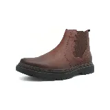 Bota Chelsea de cuero color azul marino, con elásticos laterales y suela track color marrón.