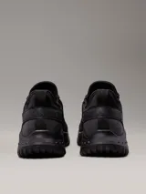 Zapatillas urbanas Calvin Klein Jeans modelo Eva Runner, color negro, confeccionadas en malla reciclada y material sintético, con logo en el lateral.