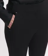 Pantalón cigarrete negro de algodón satinado con cintura elástica en la espalda, bolsillos traseros y cierre delantero con cremallera.