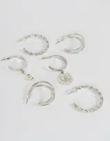 Set de tres pares de aros argollas plateadas: un par con strass, un par trenzadas y un par con dije de serpiente y dije de ojo turco.