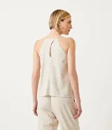 Blusa musculosa con cuello halter y estampado geométrico.