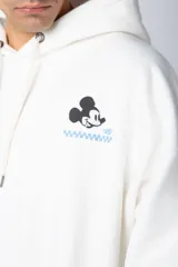 Buzo canguro negro de algodón friza, corte oversize y estampa de Mickey Mouse con detalles en verde.