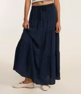 Pollera midi azul marino con estampado de lunares blancos, cintura elástica con lazo y volados.