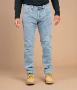 Jeans azul oscuro de corte slim, con tecnología Coolmax para confort térmico y elasticidad.