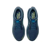 Championes de running New Balance Fresh Foam X 1080v12, color azul con detalles en amarillo y gris.