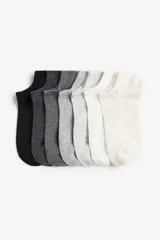 Pack de soquetes blancos de algodón con borde superior elástico y tejido de punto fino acanalado.