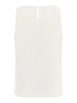 Musculosa blanca de tejido texturizado con cuello redondo y pequeña abertura en la espalda.
