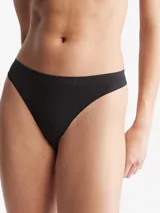 Colaless de microfibra elástica negra, con logotipo de Calvin Klein en relieve y bordes limpios.
